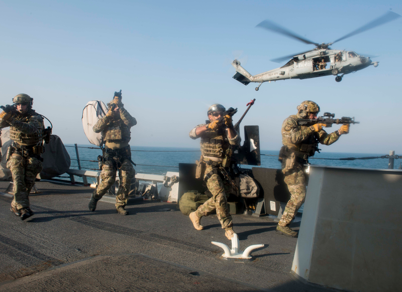 U.S. Coast Guard boarding team training on the guided missile destroyer USS Russell.